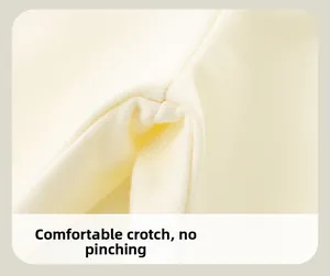 Close-up of comfortable crotch seam on cream cotton kids pants with smooth stitching