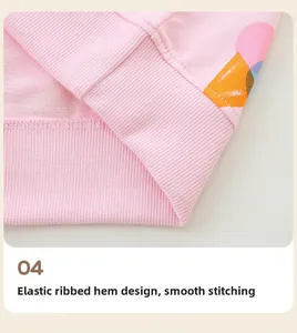 Detail of girls pink sweatshirt showing elastic ribbed hem and smooth stitching