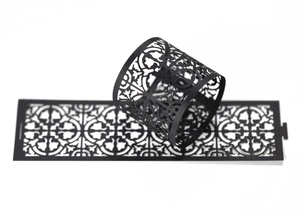Detail of black laser-cut hollow pattern paper ring for festive party decorations