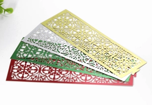Detailed laser-cut metal bookmarks with floral patterns in gold silver red and green colors