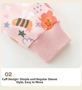 Detail of pink knitted cotton sleeves with bee print and ribbed cuff finish