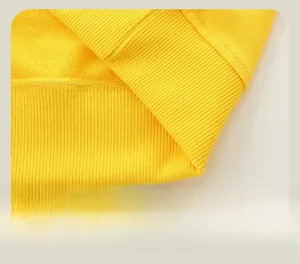 Detail of the yellow boys sweatshirt showing ribbed hem and smooth stitching crafts