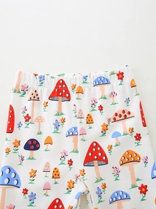 Leggings bianchi da bambina con stampe di funghi colorati e comoda vita elasticizzata