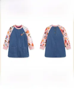 Detailed front and back view of denim girls' dress with floral embroidery and cartoon sleeves
