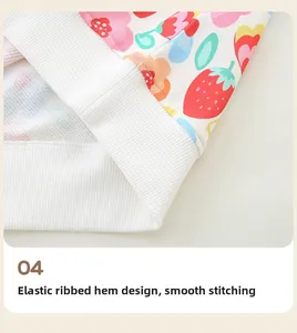 Close-up of elastic ribbed hem and strawberry floral print on girls' sweatshirt