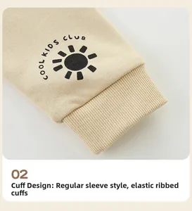 Detail of elastic ribbed cuffs on a cream kids hoodie with Cool Kids Club print