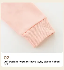 Detail of pink Christmas sweatshirt showing elastic ribbed cuffs and soft cotton knit fabric