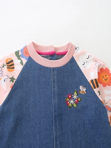 Denim dress with floral bee embroidery and pink patterned sleeves for girls