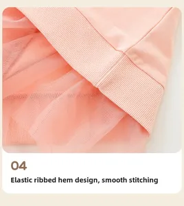 Detail of pink sweatshirt elastic ribbed hem with soft layered tulle mesh stitching