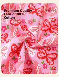 Close-up of 100% cotton pink fabric with red butterfly embroidery and floral print