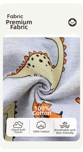 Close-up of 100% cotton fabric with yellow dinosaur print for boys jogger pants