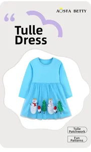 Detail of baby blue Christmas dress with tulle skirt featuring snowman and tree patches