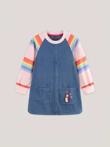 Girls denim dress with rainbow striped sleeves and cute penguin embroidery detail