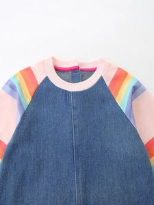 Denim dress for girls featuring rainbow striped raglan sleeves and pink ribbed neckline