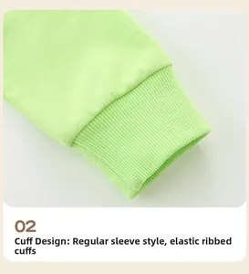Detail of elastic ribbed cuffs on a light green cotton sweatshirt for young girls