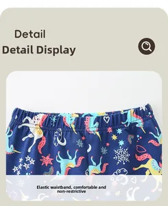 Détail de la taille élastique et des motifs licorne sur leggings en coton bleu marine