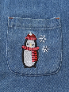 Denim dress with cute penguin embroidery and snowflake detail on front pocket
