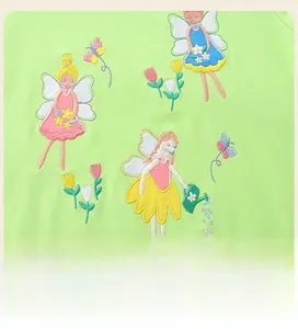 Detailed view of fairy embroidery on the green cotton sweatshirt for young girls