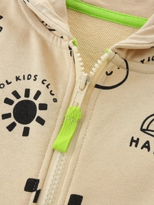 Kids zip-up hoodie in beige cotton with sun print and green zipper pull detail