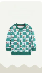 Detail of kids checkered sweatshirt with colorful cartoon tractor patterns and green ribbed cuffs