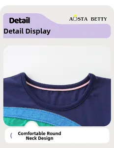 Close-up of girls navy mesh dress with pink neckline detail and geometric patterns