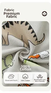 Close-up of 100% cotton fabric with colorful cartoon dinosaur prints for boys' sweatshirt
