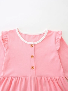 Pink toddler princess dress with long sleeves, ruffle shoulders and wood buttons