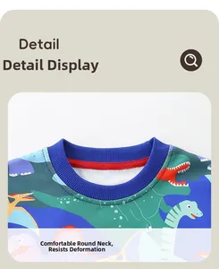 Detail of blue crew neck with red reinforcement tape and colorful dinosaur prints