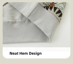 Close-up of ribbed hem on light gray boys sweatshirt with neat stitching and knit fabric