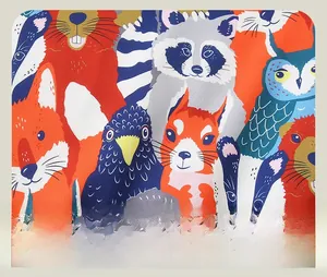 Close-up of colorful cartoon forest animal print with detailed textile texture