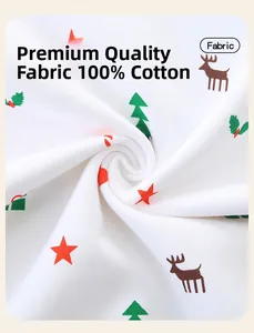 Detail shot of 100% cotton fabric with festive Christmas patterns and soft texture