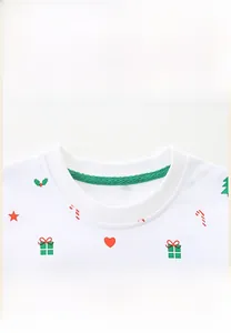 Close-up of ribbed round neck collar on a white Christmas themed girls cotton sweatshirt