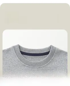 Macro detail of the ribbed crew neck on a grey knit sweatshirt with reinforced blue taping