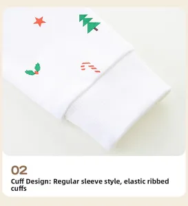 Detail of elastic ribbed cuffs on girls' white sweatshirt with festive Christmas patterns