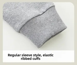 Detail of grey knitted ribbed cuffs on kids sweatshirt featuring elastic cotton fabric
