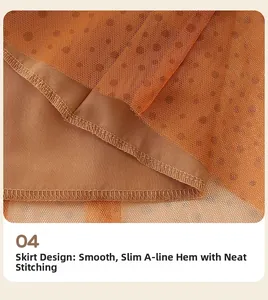 Detail of A-line mesh skirt featuring brown polka dot pattern and neat stitching work