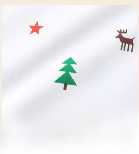 Detailed view of the Christmas patterns and cotton fabric texture on kids sweatshirt