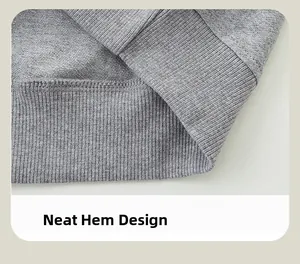 Detailed close-up of the grey sweatshirt ribbed hem with neat double-stitch sewing