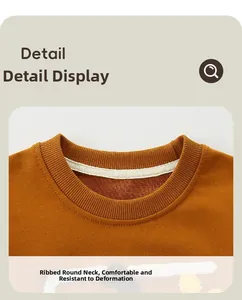 Detail view of the ribbed crewneck and reinforced collar on the ginger orange kids sweatshirt