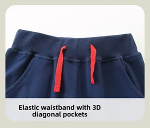 Détail du pantalon enfant bleu marine avec taille côtelée élastique et cordon rouge
