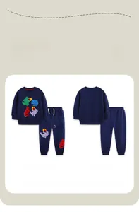 Detail view of boys navy blue tracksuit with colorful dinosaur embroidery and joggers