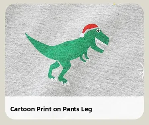 Détail du pantalon en tricot gris pour enfant avec imprimé dinosaure de Noël