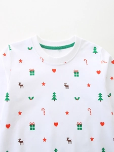 White crewneck girls sweatshirt with festive Christmas patterns including reindeer and trees