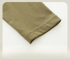 Detail of olive green knit sleeve cuff with durable double-stitched flat seams