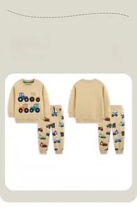 Detail of kids beige sweatshirt and joggers set with colorful vehicle embroidery pattern