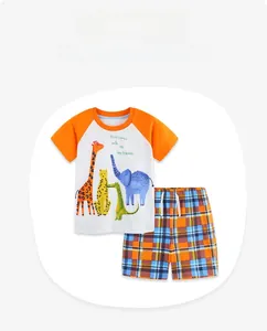 Detail of boys' summer set showing cartoon animal print T-shirt and plaid shorts