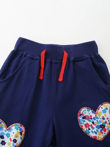 Navy blue boys' sports pants with floral heart patches and red decorative drawstrings