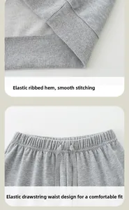 Detailed close-up of grey knit sweatshirt ribbed hem and elastic drawstring waistband