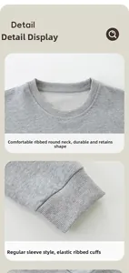Detail of ribbed crew neck and elastic cuffs on a grey cotton knitted kids sweatshirt