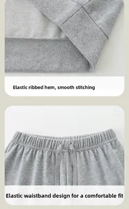 Detail of grey kids sweatshirt ribbed hem and elastic drawstring waistband with fine stitching